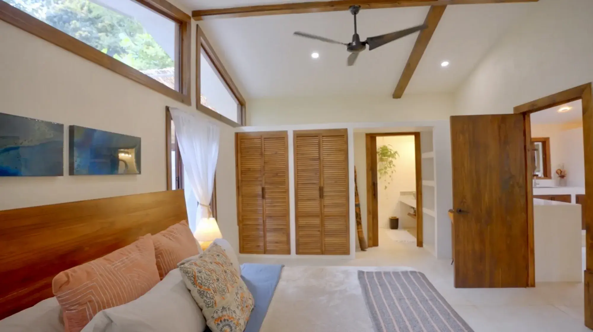 Master bedroom with vaulted ceiling and ensuite bath in the Costa Rica mountain estate