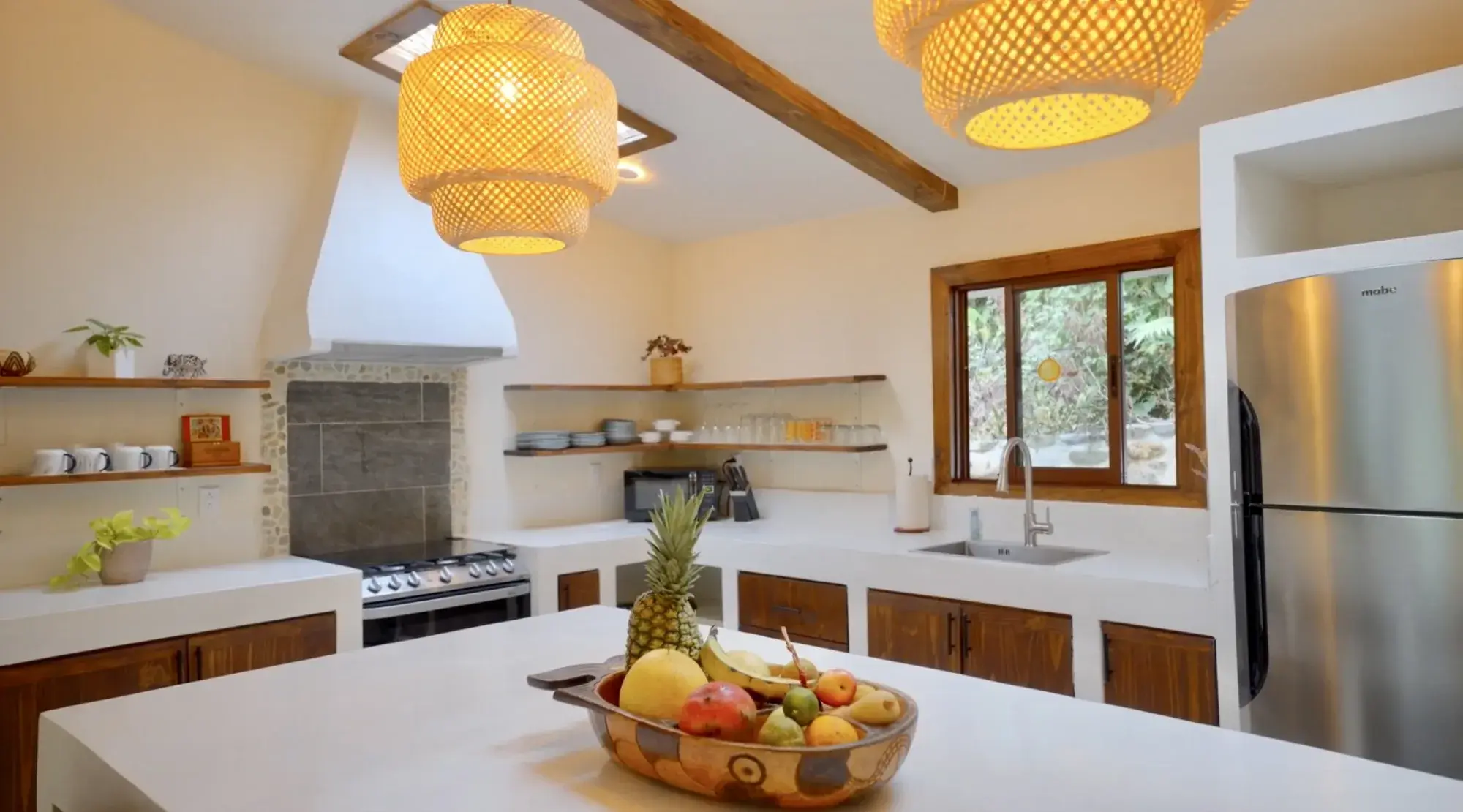 Modern kitchen with breakfast bar in the turnkey Costa Rica mountain home