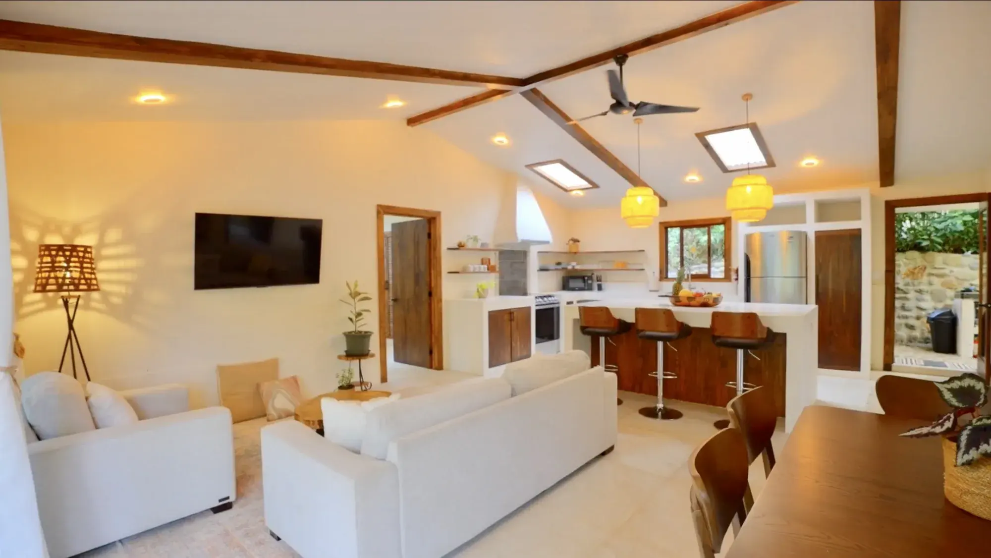 Open plan living room and kitchen in the renovated main residence of the Costa Rica estate